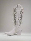 White cowboy boot with decorative patterns on a white background