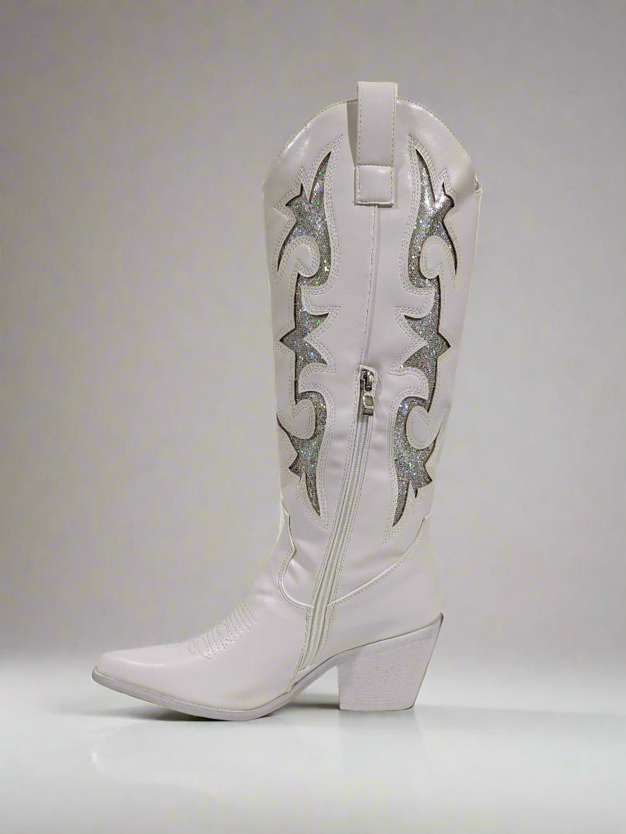 White cowboy boot with decorative patterns on a white background