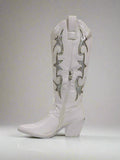 White cowboy boot with decorative patterns on a white background