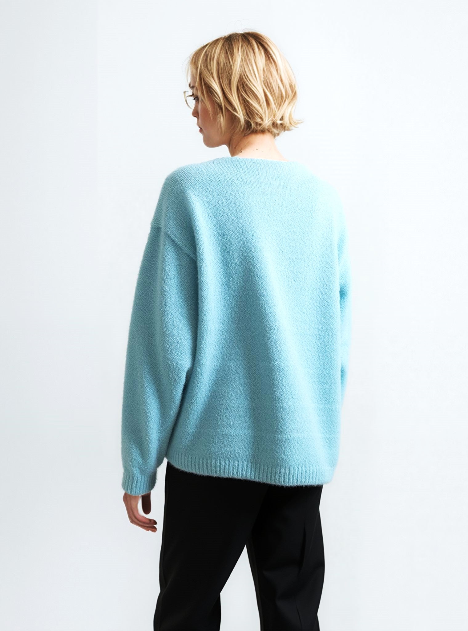 Soft Blue V-Neck Sweater with Floral Brooch